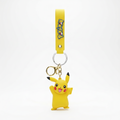 A yellow Pikachu character keychain featuring a 3D character charm and a matching yellow strap with the Pokémon logo, set against a plain white background.