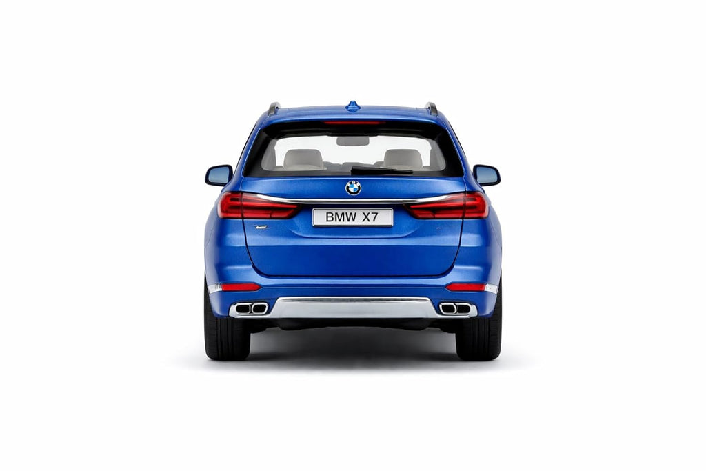 Blue BMW X7 SUV shown from a rear three-quarter view on a white background