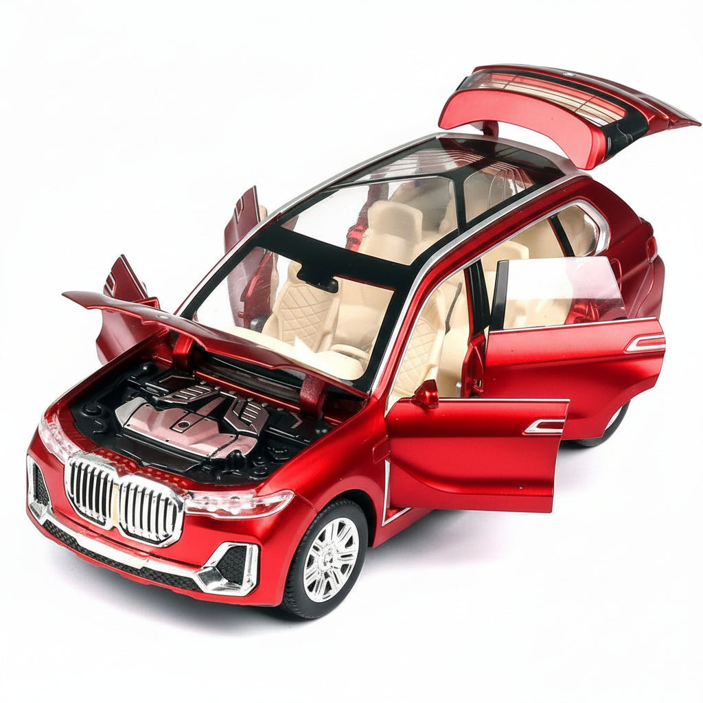 Red toy car with open doors and hood on a white background
