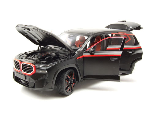 Black SUV model with open hood on a white background