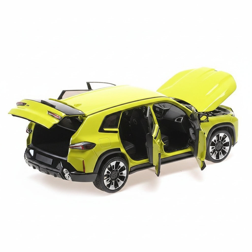 Yellow model car with open doors and trunk on a white background