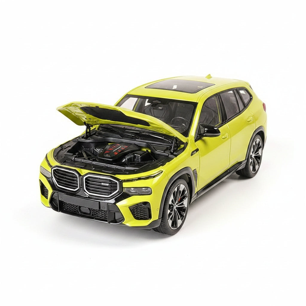 Yellow toy car with open hood showing engine details on a white background