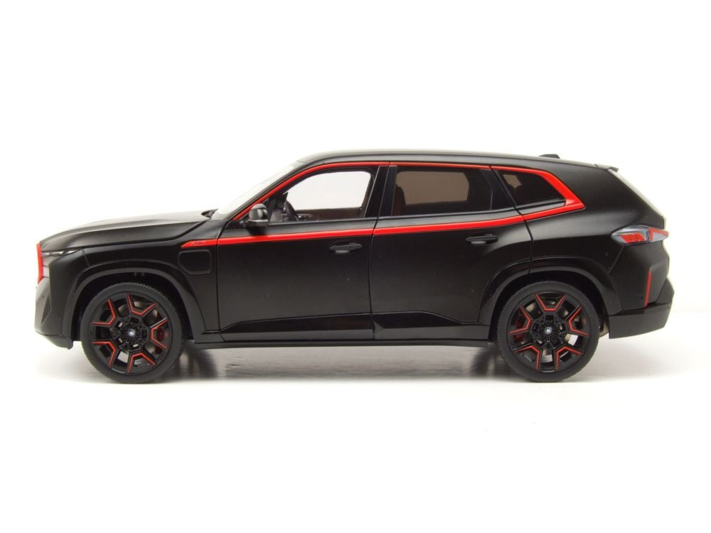 Black SUV model with red accents on a white background