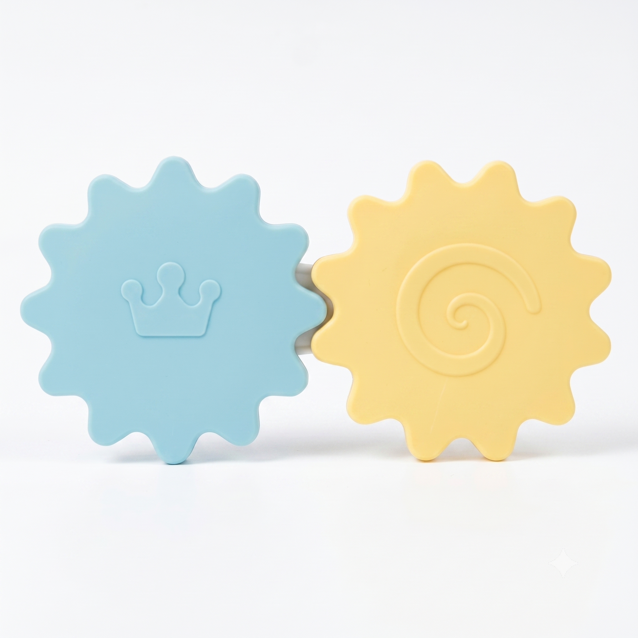 Two colorful sun-shaped toys, one blue with a crown and one yellow with a spiral, on a white background.
