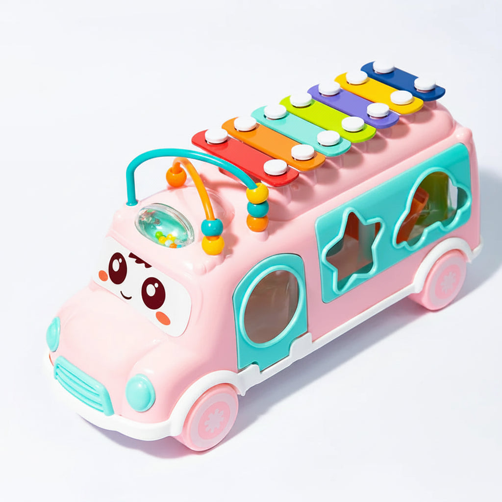 Colorful toy bus with a xylophone on top against a white background