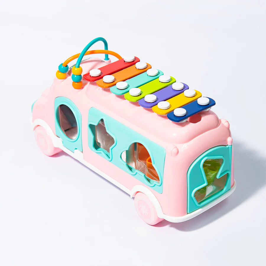 Colorful toy bus with a xylophone on a white background