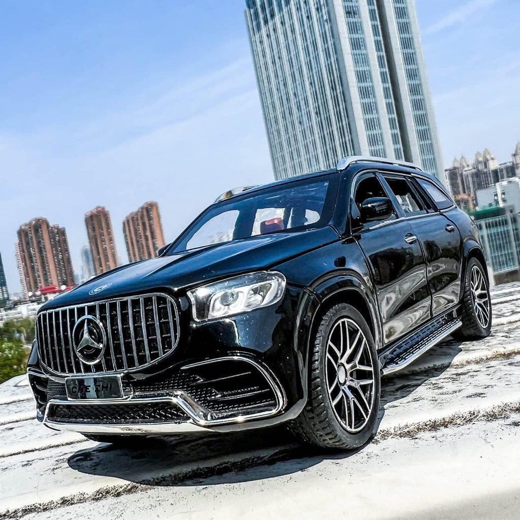 Black Mercedes-Benz SUV parked on a rooftop with cityscape in the background