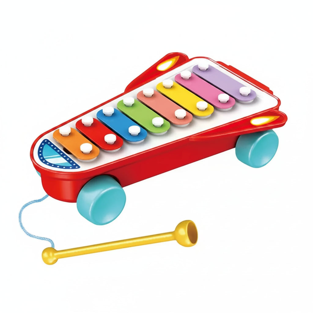 Colorful toy xylophone with a drumstick on a white background