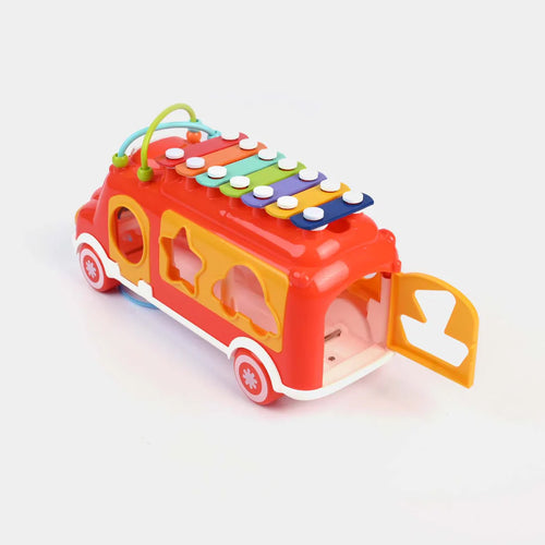 Colorful toy bus with a door open on a white background