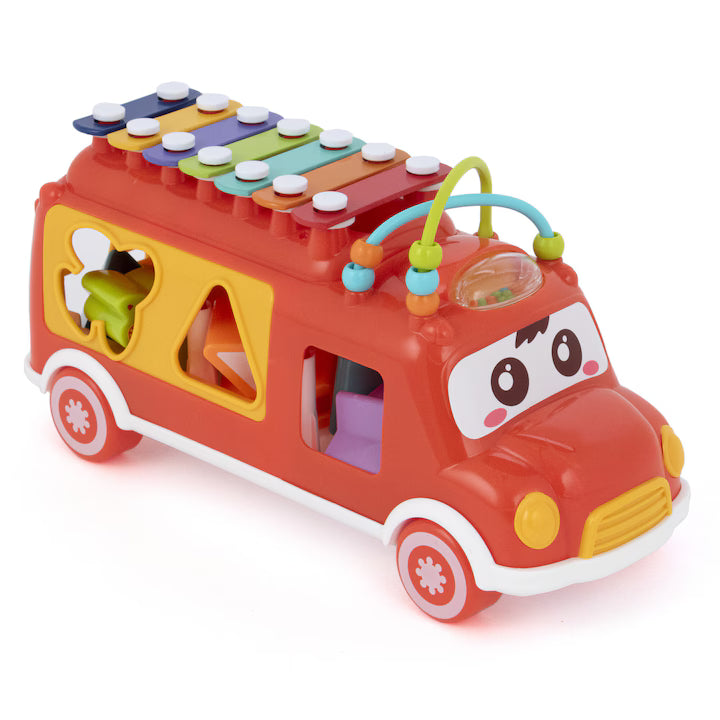 Colorful toy bus with a xylophone on top against a white background