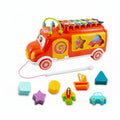 Colorful toy bus with shape sorter on a white background