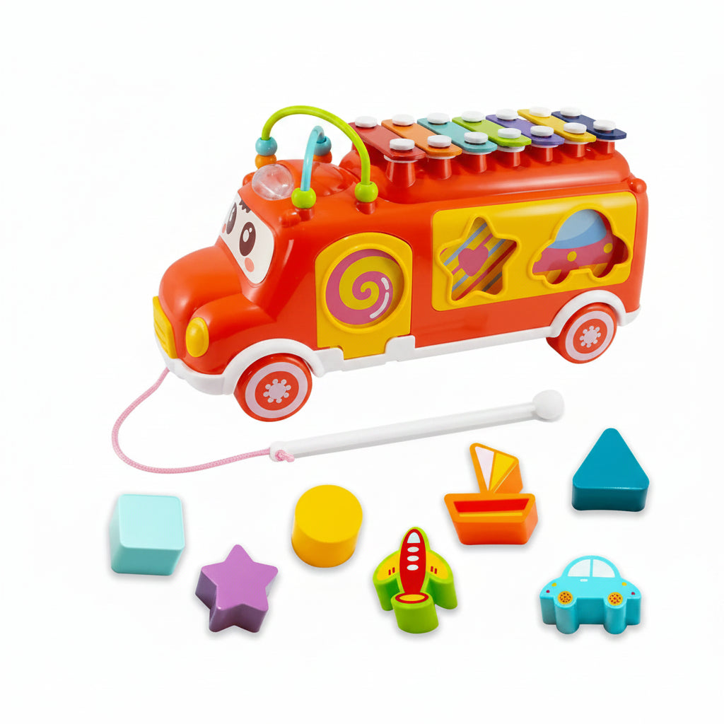 Colorful toy bus with shape sorter on a white background