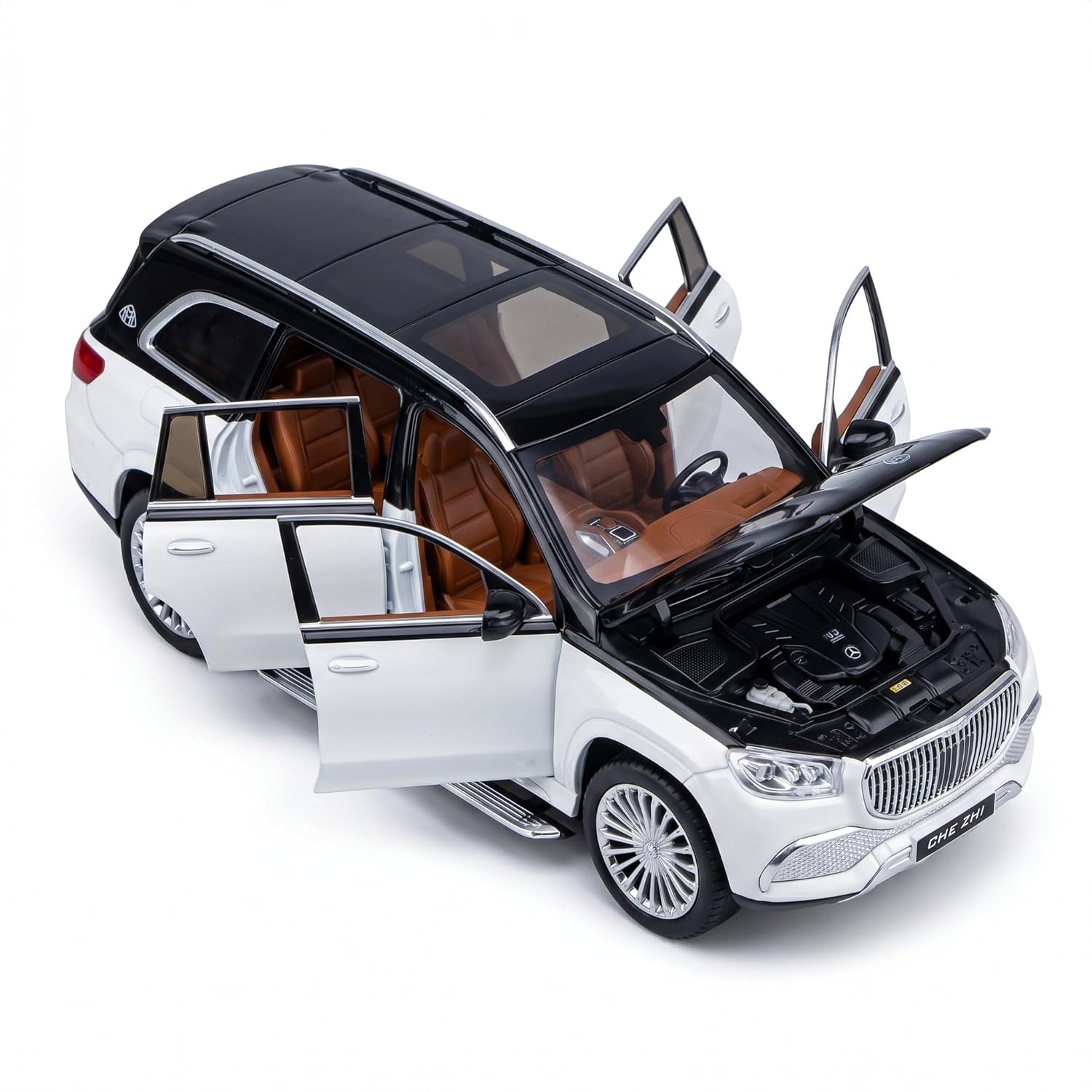 Model car of a luxury SUV with open doors on a white background
